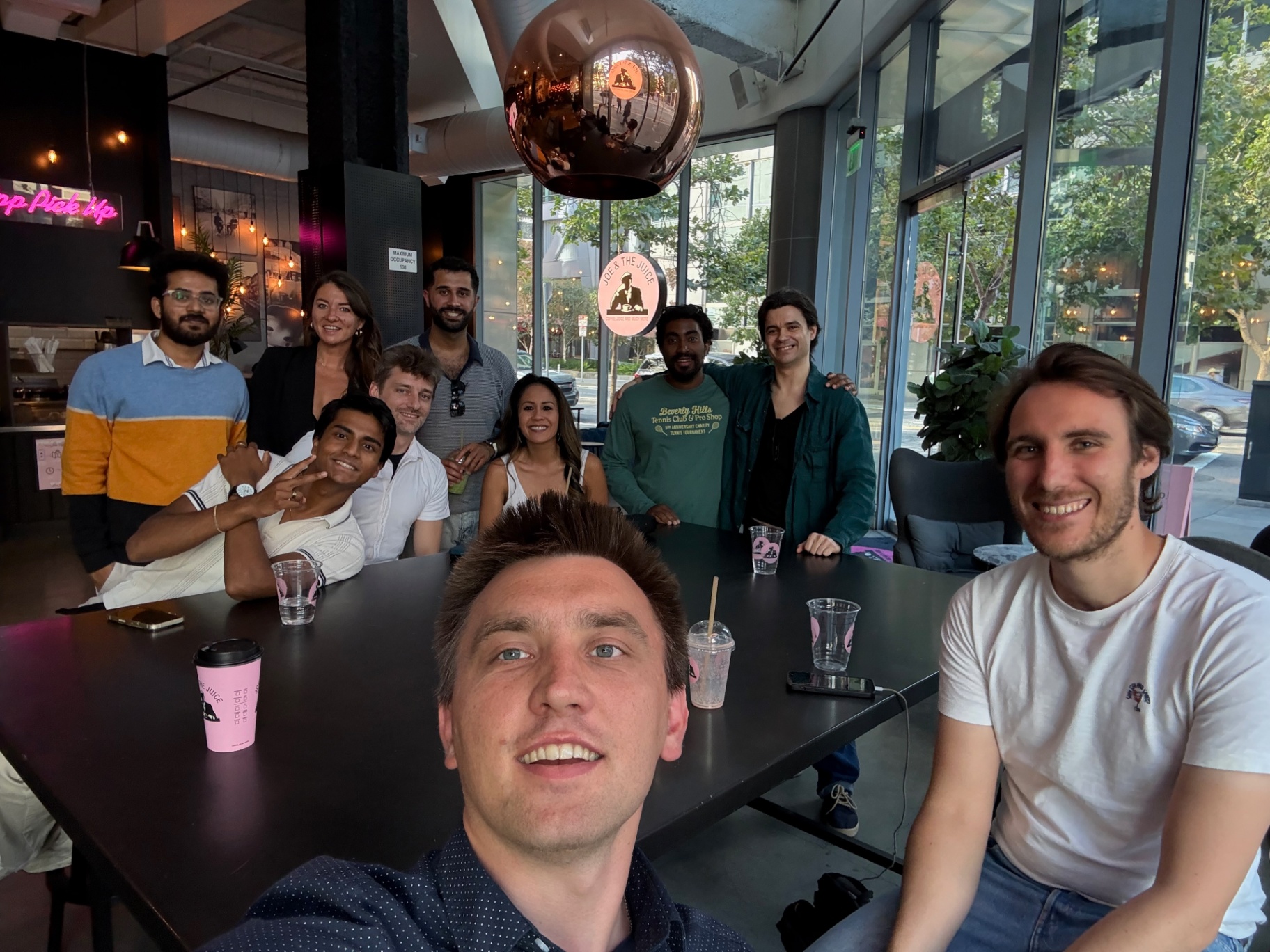 Founders gathered around a large table at the venue
