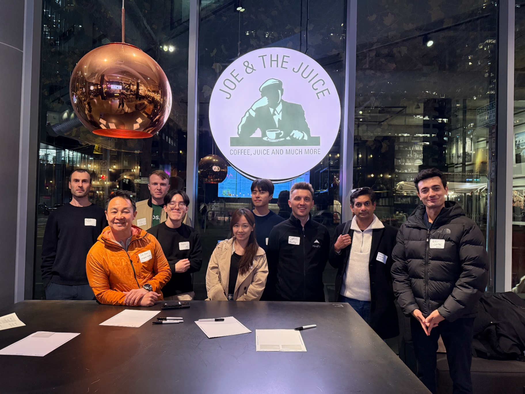 Smaller founders group around the sign-in table