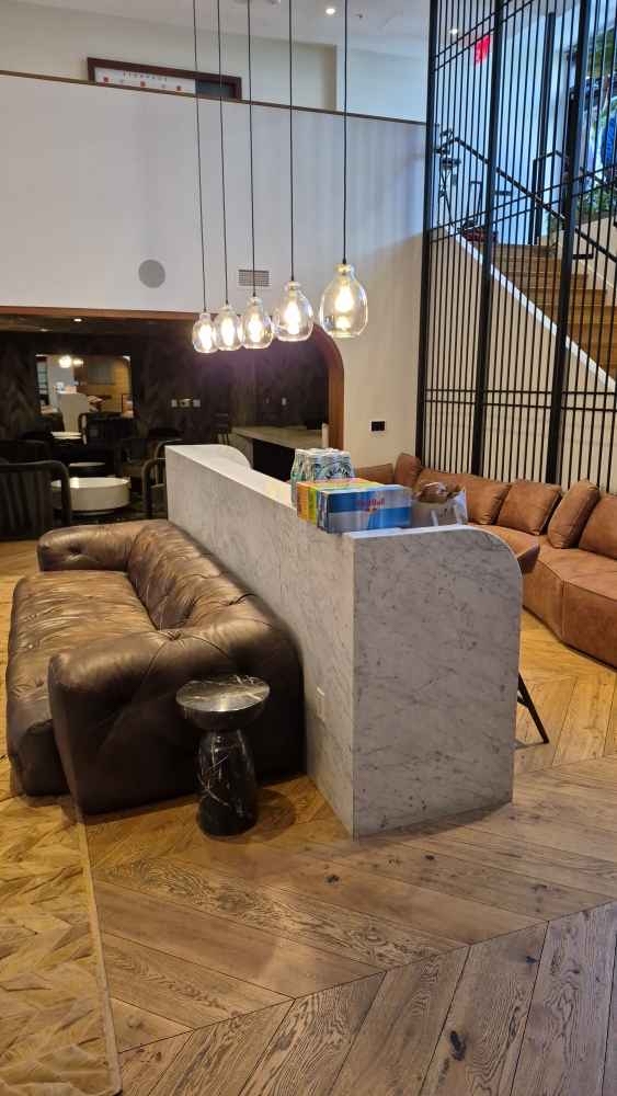Venue bar with pendant lights and leather couches